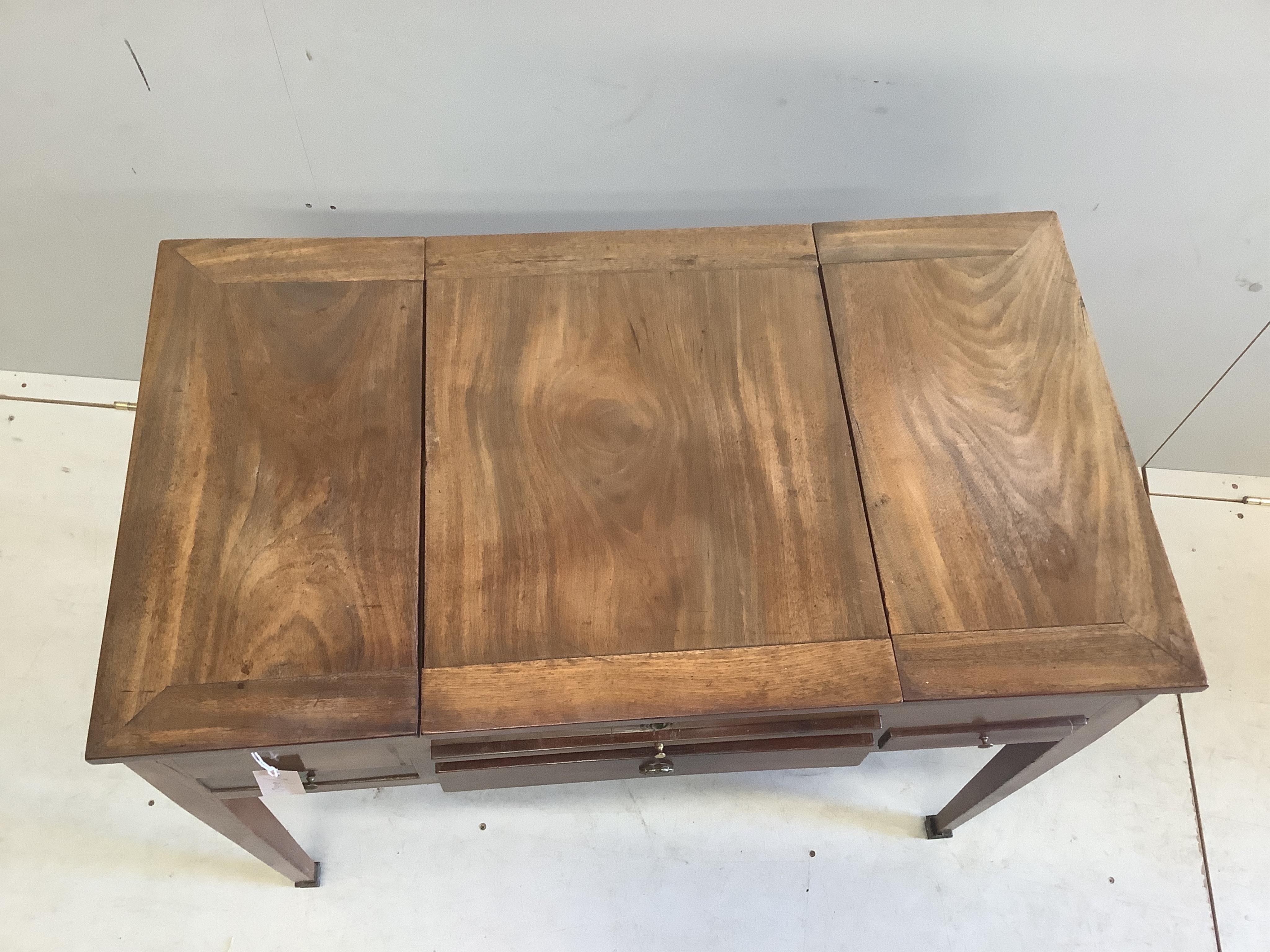 A 19th century Continental mahogany enclosed dressing table, width 86cm, depth 49cm, height 71cm. Condition - fair